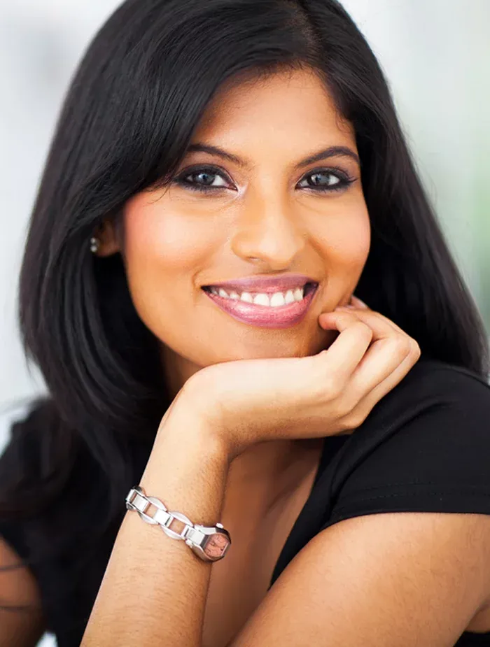 Bioidentical Hormone Replacement Therapy Lady Smiling With Her Head Restong On Her Hand