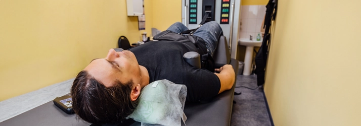 Man In Spinal Traction Machine