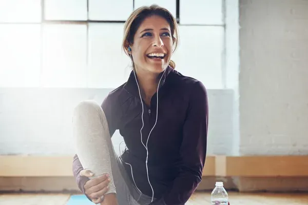 Bioidentical Hormone Replacement Therapy Active Woman With Headphones Smiling