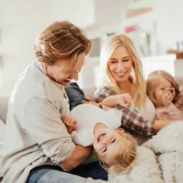 Family Playing On The Couch