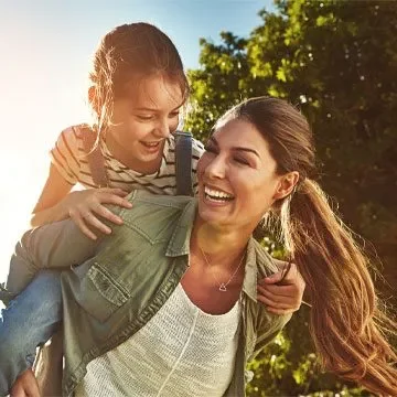 Woman With A Child In Nature