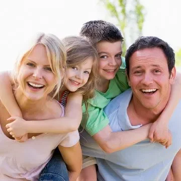 Woman With Family Outdoors